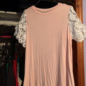 Pink shirt with white lace sleeves